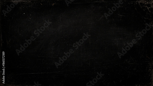 scratched black surface with scratches and marks