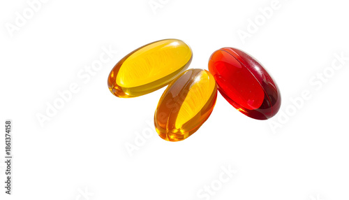 Three translucent softgel capsules, red, orange, and yellow, against a stark black background