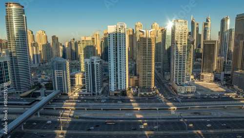 Photography Dubai Marina skyscrapers aerial top view during sunrise from JLT in Dubai night to day timelapse, UAE