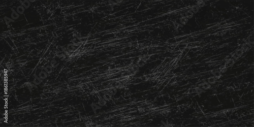 An abstract dark grunge pattern features a rough black and white paper texture with a macro gray textile surface reminiscent of old leather material for a textured wallpaper design