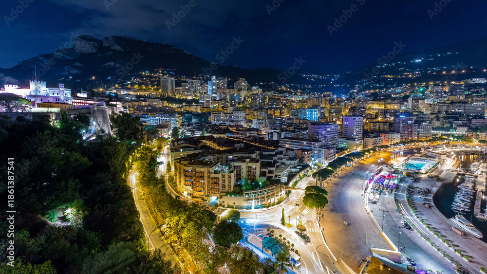 Fototapeta premium Panorama of Monte Carlo day to night timelapse from the observation deck in the village of Monaco near Port Hercules