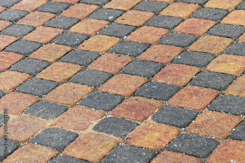 фотографія A close-up view of a patterned walkway, background photo