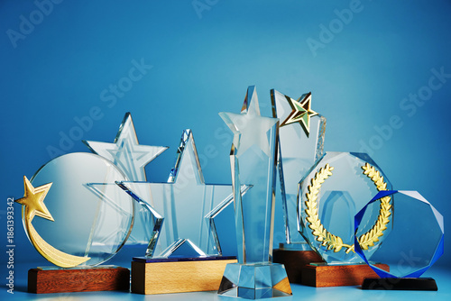 group of crystal trophy against blue background