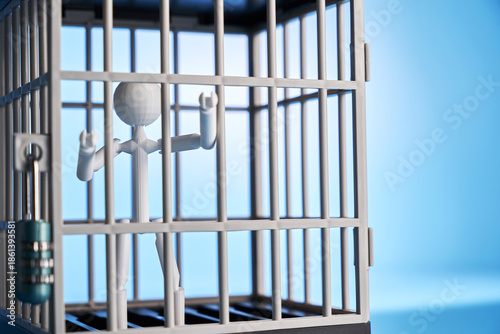 stickman in a  cage against blue background