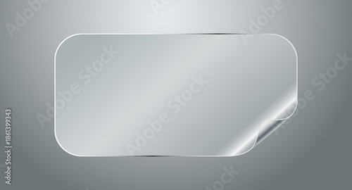 A shiny metallic rectangle with a peeled corner on a gray background