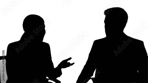 Professional silhouettes engaged in a dynamic conversation or interview session
