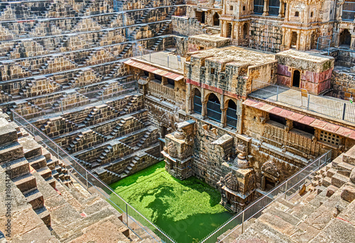 Chand Baori in Abhaneri, built in the 8th–9th century CE by King Chanda, is a deep, geometric stepwell with 3,500 steps, showcasing ancient water conservation, climate-smart design.