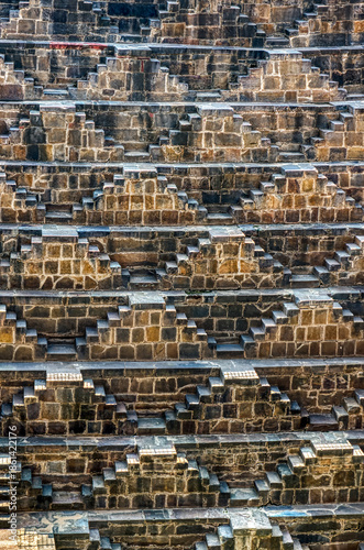 Chand Baori in Abhaneri, built in the 8th–9th century CE by King Chanda, is a deep, geometric stepwell with 3,500 steps, showcasing ancient water conservation, climate-smart design.