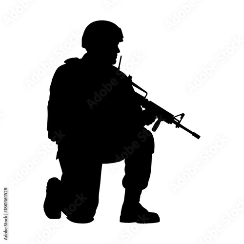 Silhouette of a soldier kneeling with rifle ready for battle