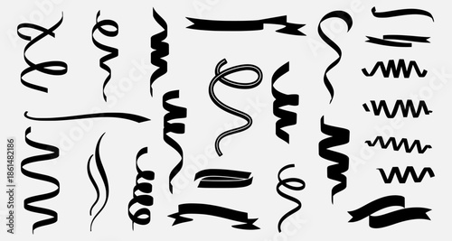 Various black ribbons and swirls arranged in a decorative pattern on a white background