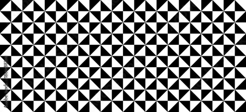 Seamless geometric triangle pattern with dense black and white repeating shapes, creating bold abstract background for surface design, wallpaper, textile, packaging and modern graphic use