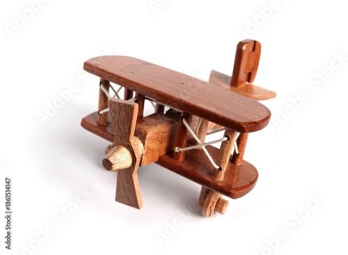 Toy wooden biplane airplane model isolated on white background closeup view
