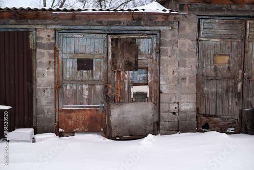 Photos Weathered wooden garage doors in winter