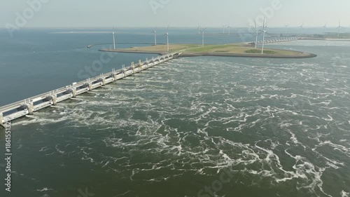 Wind farm and flood barrier (Oosterscheldekering) on the coast of the Netherlands