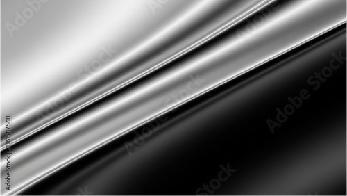 A close-up view of a metallic surface with smooth, flowing curves and a gradient of light and dark tones