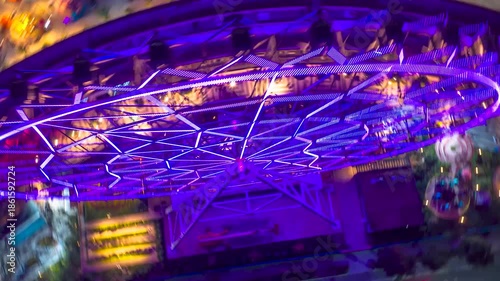 Night hyperlapse over Aztlán Park in Chapultepec Forest, highlighting the illuminated Ferris wheel as city lights and traffic flow around Mexico City’s urban core.