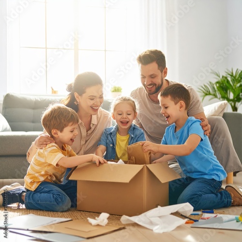 Happy Family Unboxing a Post-Purchase Delivery with Joy
