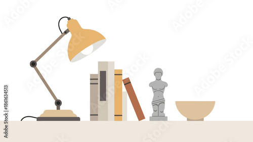 Minimalist desk setup with books, lamp, and decorative sculpture on white background