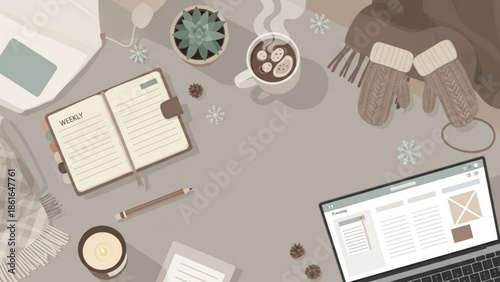 Cozy winter workspace with laptop, notebook, coffee, and warm gloves on a desk