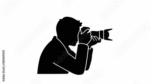 Silhouette of a photographer taking a picture with a professional camera.
