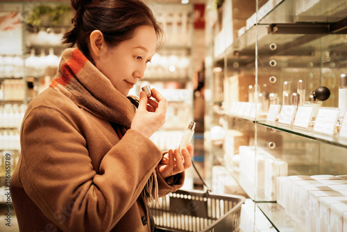 Woman Shopping for Perfume in Cosmetics Store