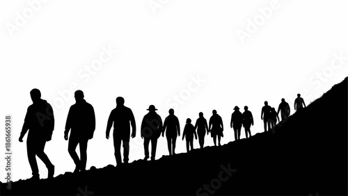 Silhouetted group of people walking uphill on a slope.