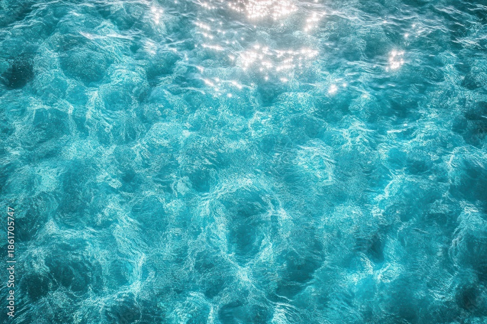 Obraz premium Sunlit turquoise water surface with gentle ripples and shimmering sparkles evoking calm, refreshing tranquility