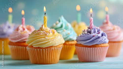 Vibrant Birthday Cupcakes: Colorful Frosting, Lit Candles & Sprinkles Delight