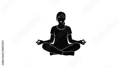 Silhouette of a woman meditating peacefully in a cross-legged pose