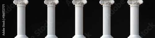 Five white ionic columns with fluted shafts and ornate capitals standing in a row against a black background, evoking timeless elegance and stately order
