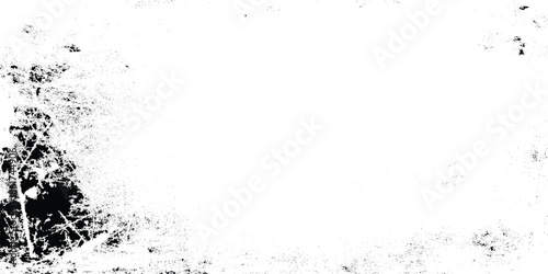 Abstract artistic grunge texture with dark smudges and white space resembling a distressed or weathered surface