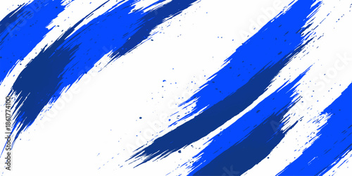 Abstract blue grunge background featuring artistic paint brush strokes and watercolor ink splatters with a decorative texture design element of blue stains and a splat pattern