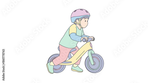 Child happily riding a balance bike with a helmet