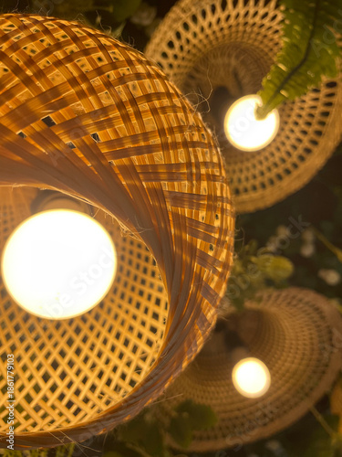 A close-up photograph of woven handcrafted objects showing circular patterns, interlaced structure, and decorative design details.