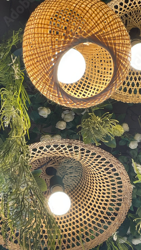A close-up photograph of woven handcrafted objects showing circular patterns, interlaced structure, and decorative design details.