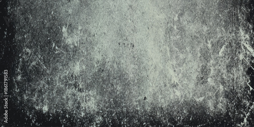A grayscale heavily textured image depicts a blurred abstract composition with subtle light and dark variations