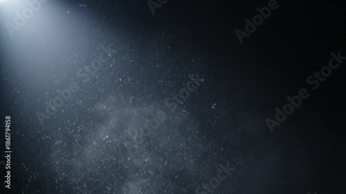 Dark Background with Spotlight and Dust Particles.