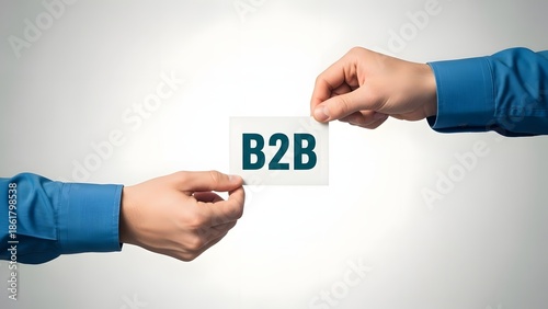 Business to business concept with two hands holding b2b card