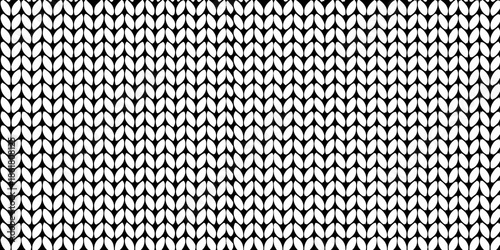 Detailed close up of a black and white textured knit fabric pattern