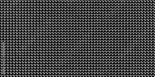 A detailed monochromatic repeating pattern of small square grid elements