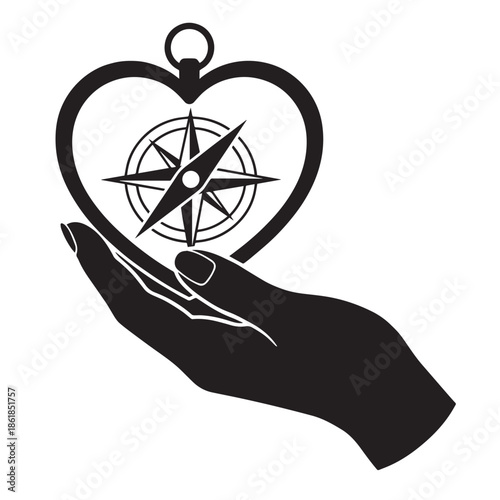 Hand holding heart shaped compass with love and direction