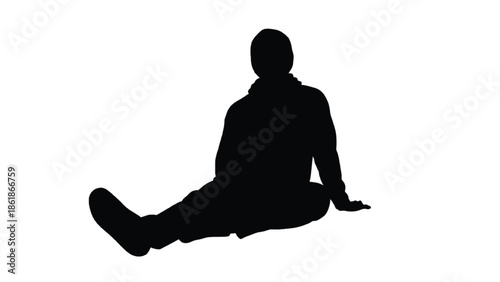 Silhouette of a man sitting on the floor male person