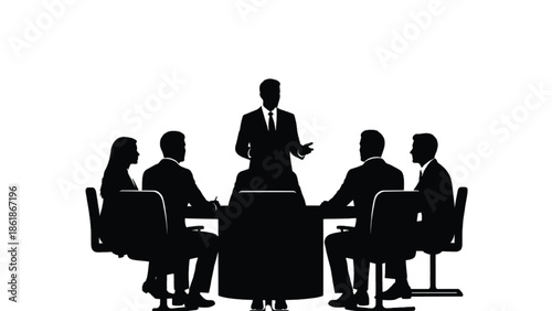 Silhouette of people in a business meeting around a conference table