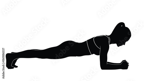 Silhouette of a fit woman performing a perfect forearm plank exercise to strengthen her core muscles during an intense physical fitness routine at home or in the gym