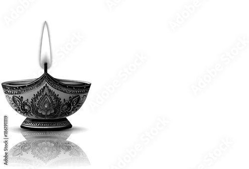 Burning classic antique oil lamp for diya on white background. Dewali or other festival icon. Copy space card, flyer, poster, banner, book title etc.