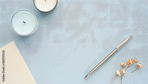 Close up of notebook and pen on table with paper and vintage items