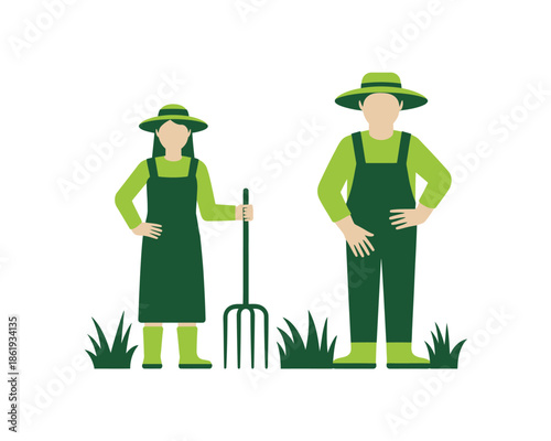 Two farmers in green overalls and hats stand in grass with gardening tools.