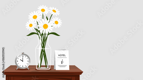 Fresh daisies in a vase on a hotel nightstand with alarm clock and information card for hospitality concept