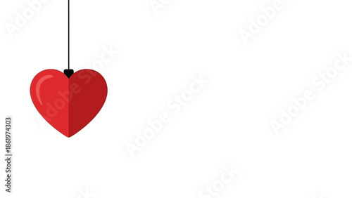 Red Heart Ornament Hanging by a String on a White Background