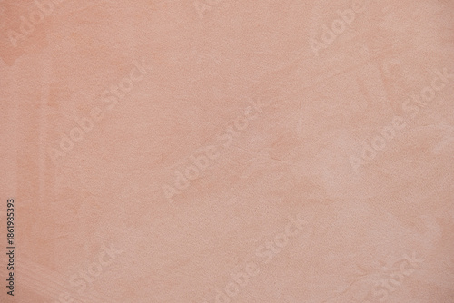 Soft warm beige textured background with subtle plaster wall surface. Minimal neutral backdrop with gentle tones, ideal for web design, branding, packaging, social media or print layouts.